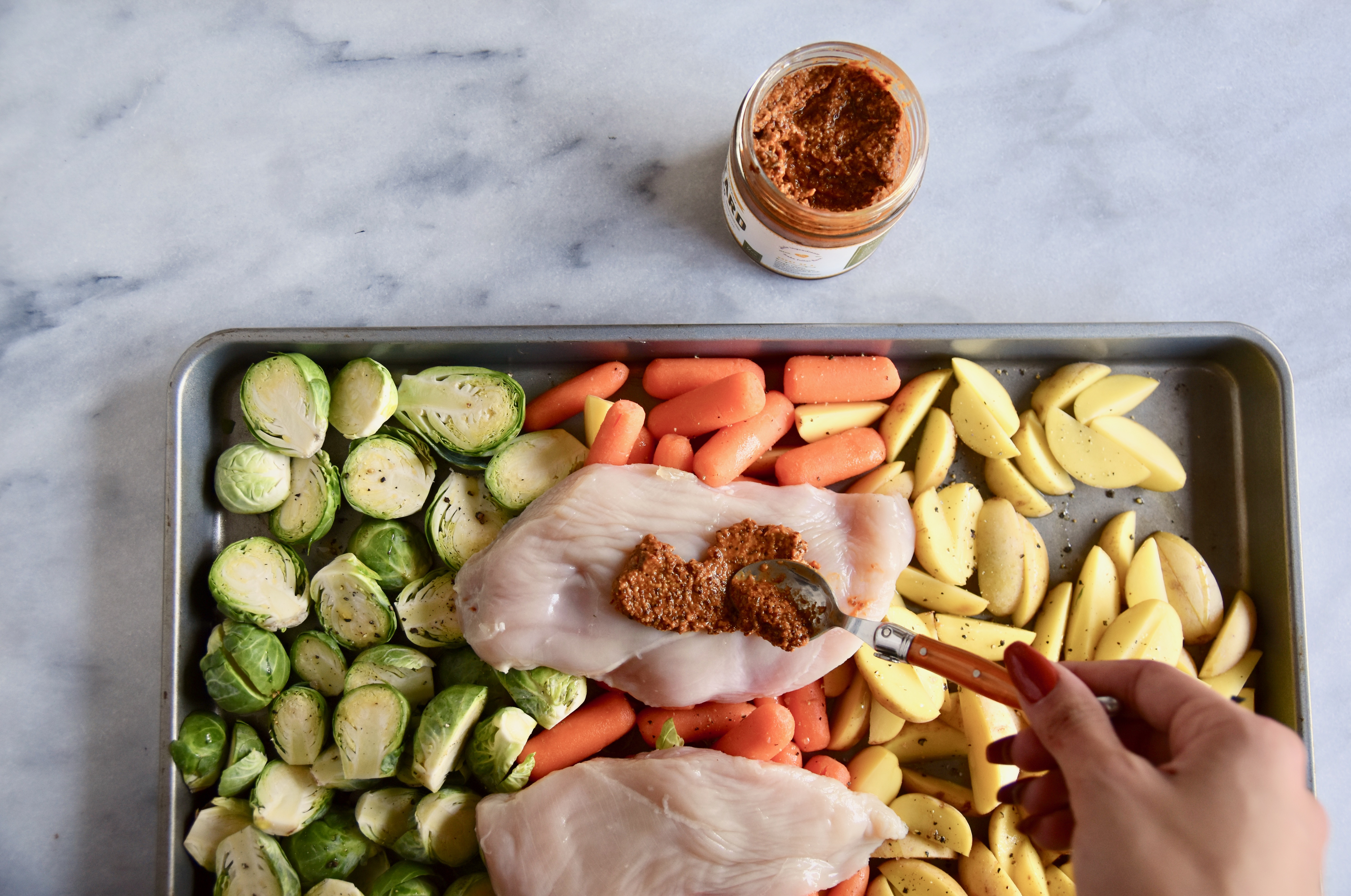 scooping Chef Alyssa's mustard onto chicken