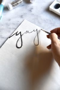 Holiday wrapping paper with watercolor 'yay'