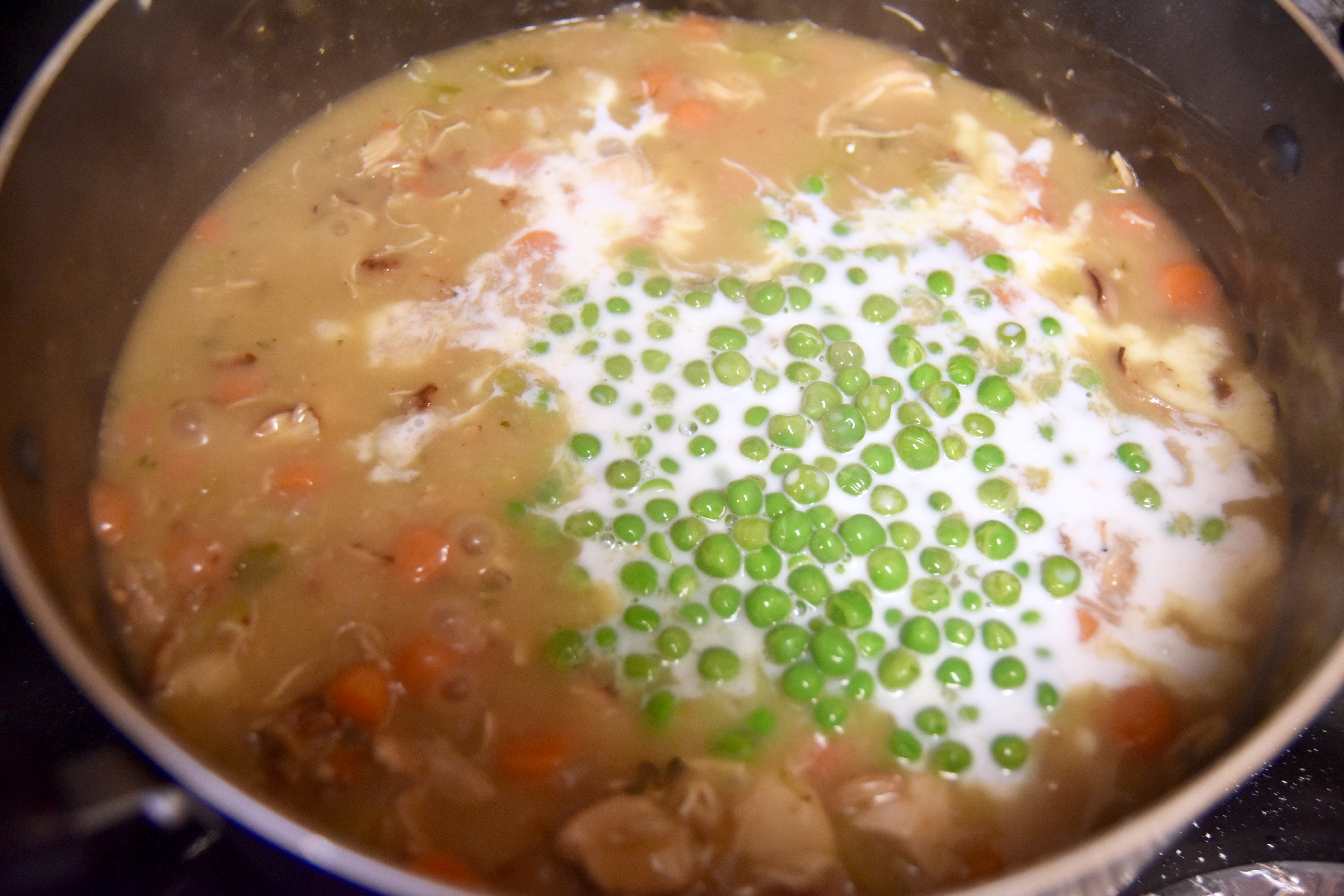 add cream and peas into stew