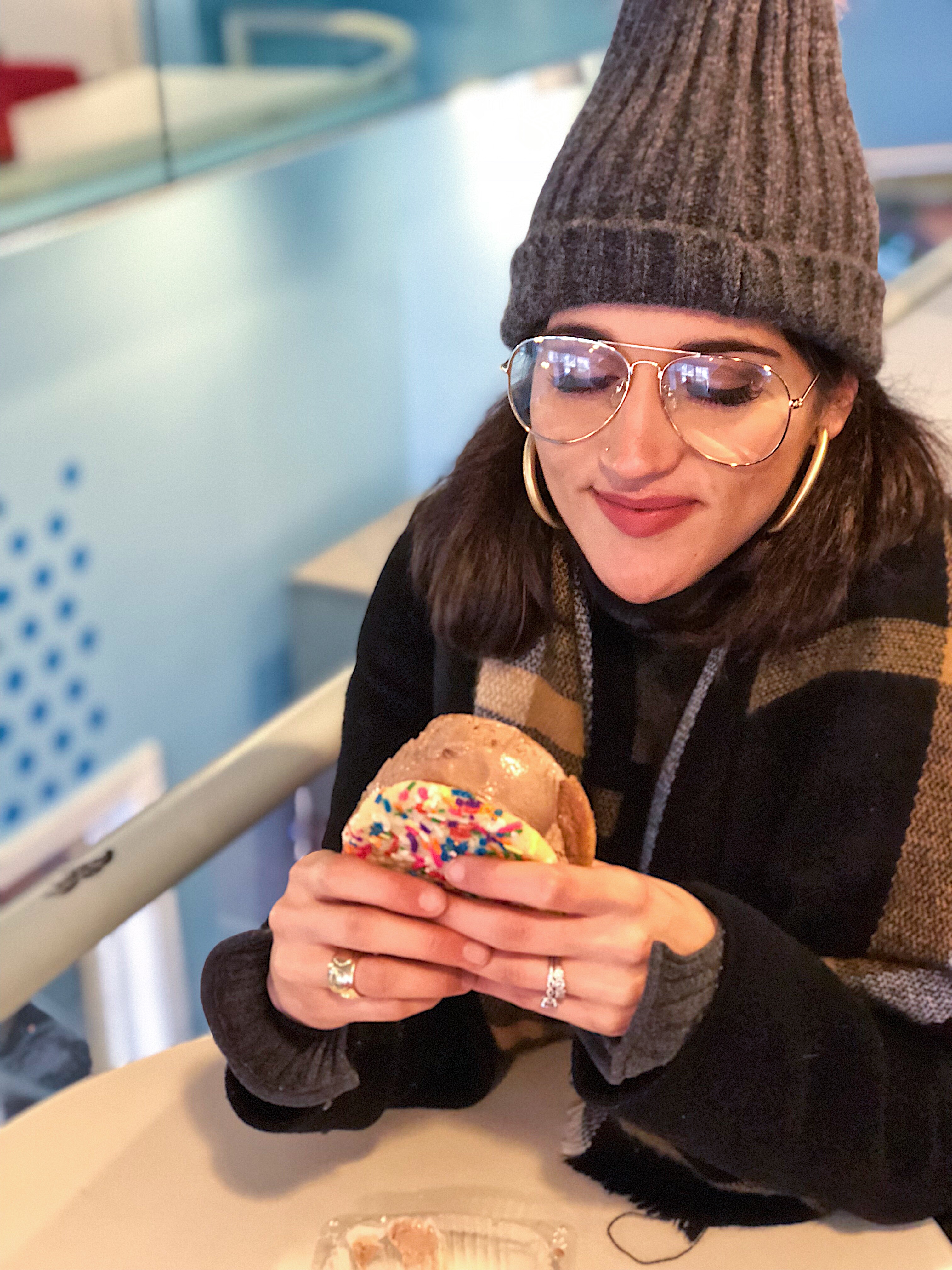 Aya eating a icecream cookie sandwich from Captain Cookie D.C.