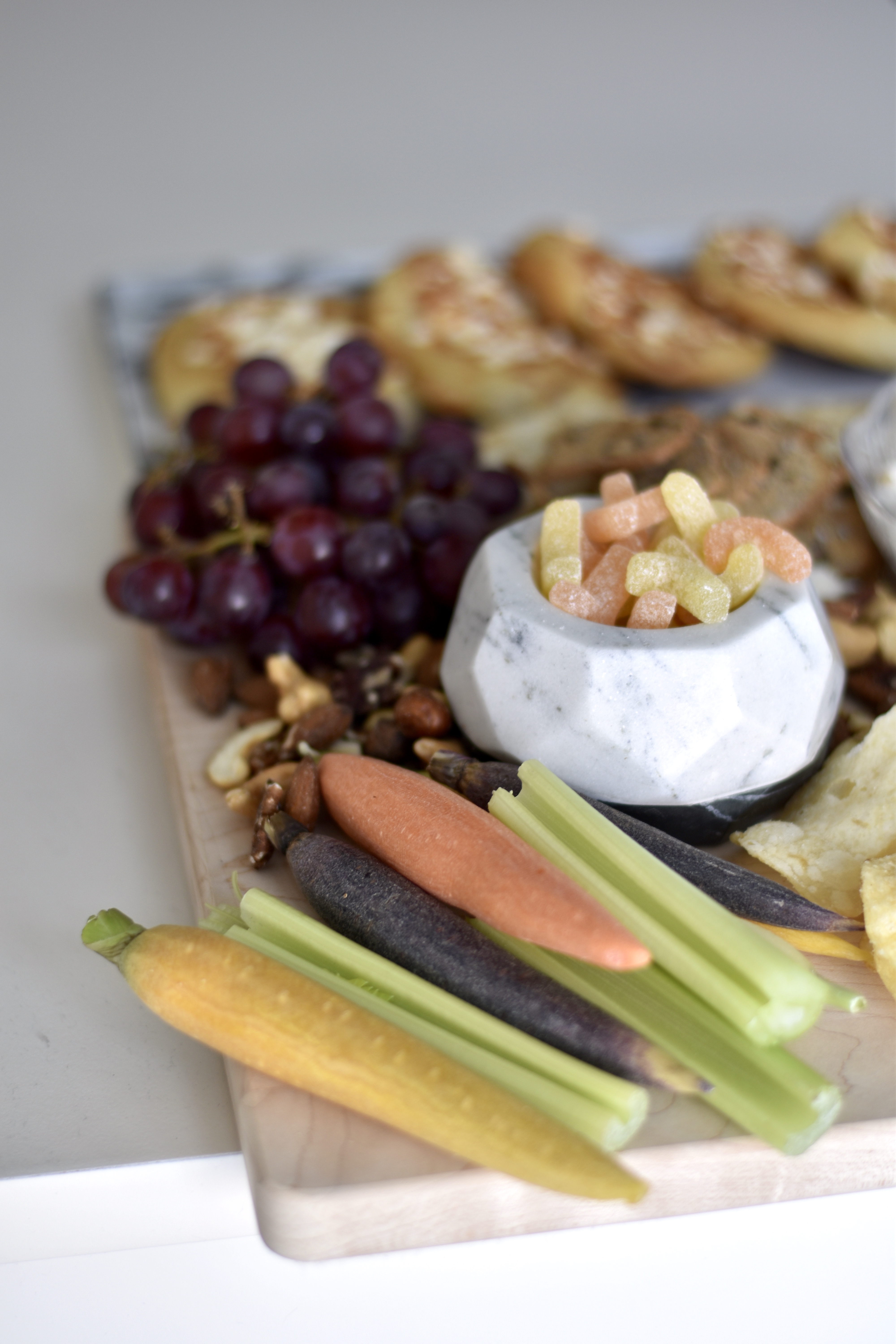 Close up of vegetables, fruits, and sour patch from Trader Joes