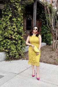 spring Boohoo yellow dress, suede pink pumps, and lemon clutch