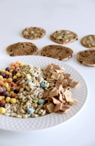 Flay lay of chocolate chip cookies, haagen daaz vanilla ice cream and cereal