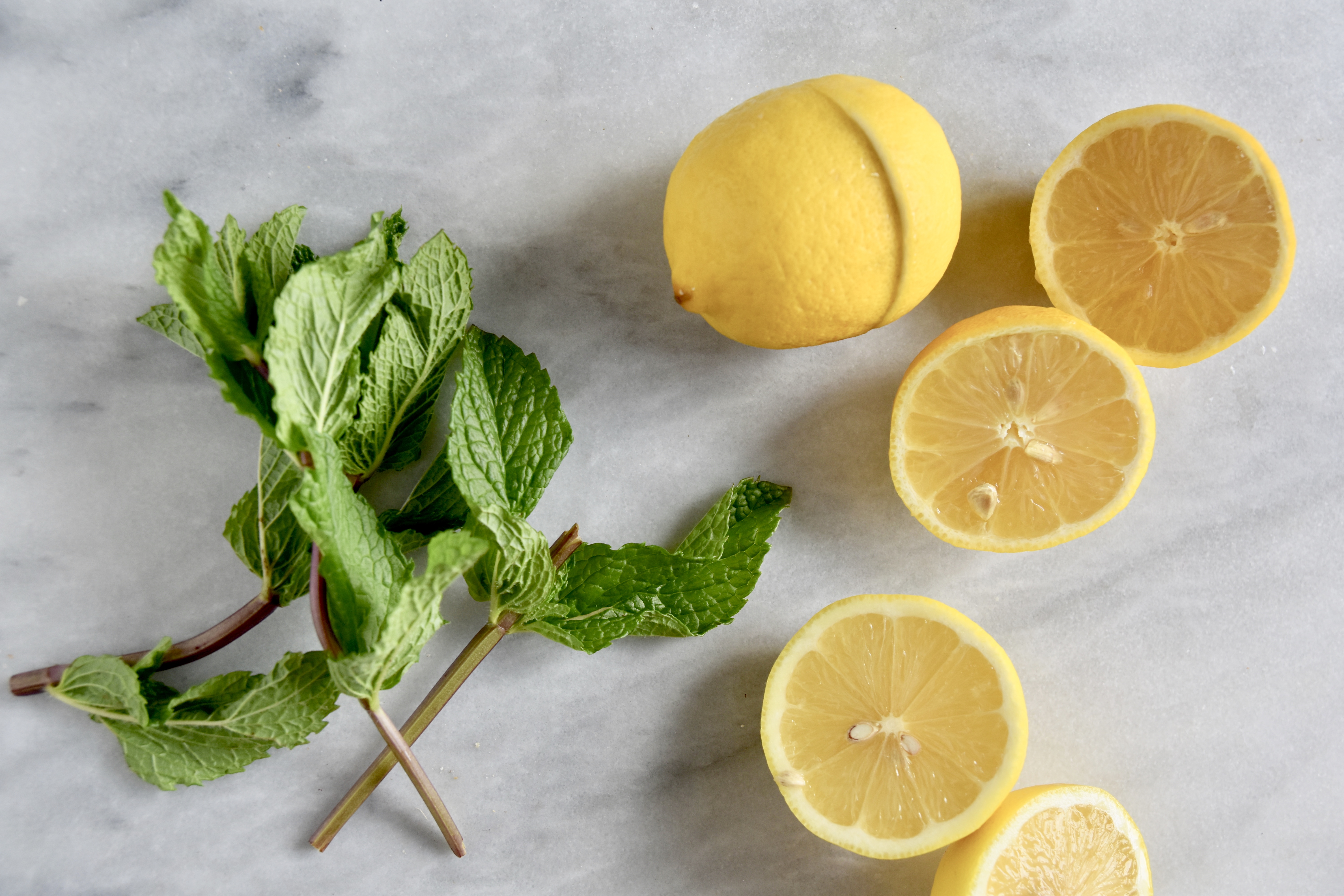 fresh mint and lemons cut in half