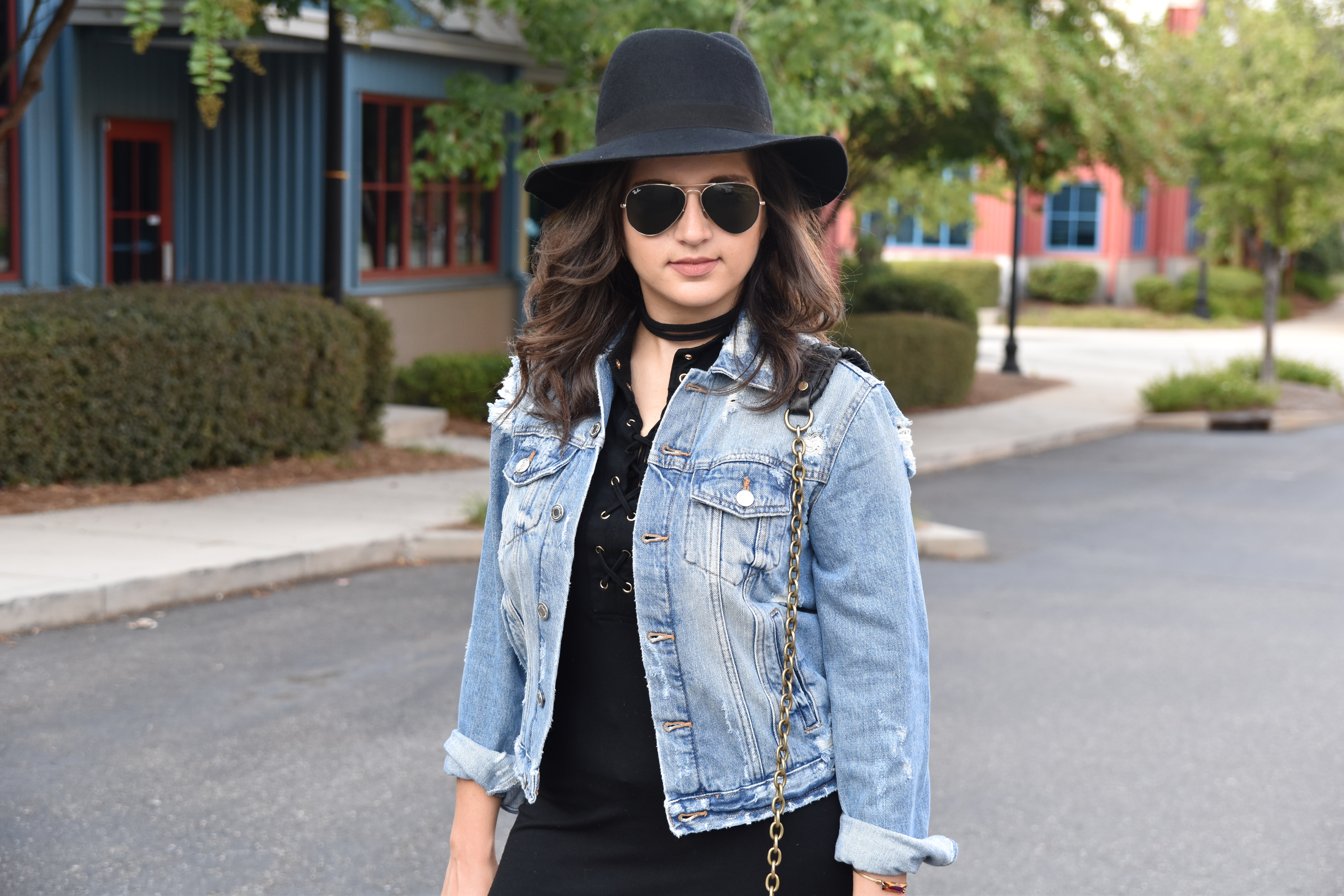 Dania outfit post with black dress and distressed Zara jean jacket