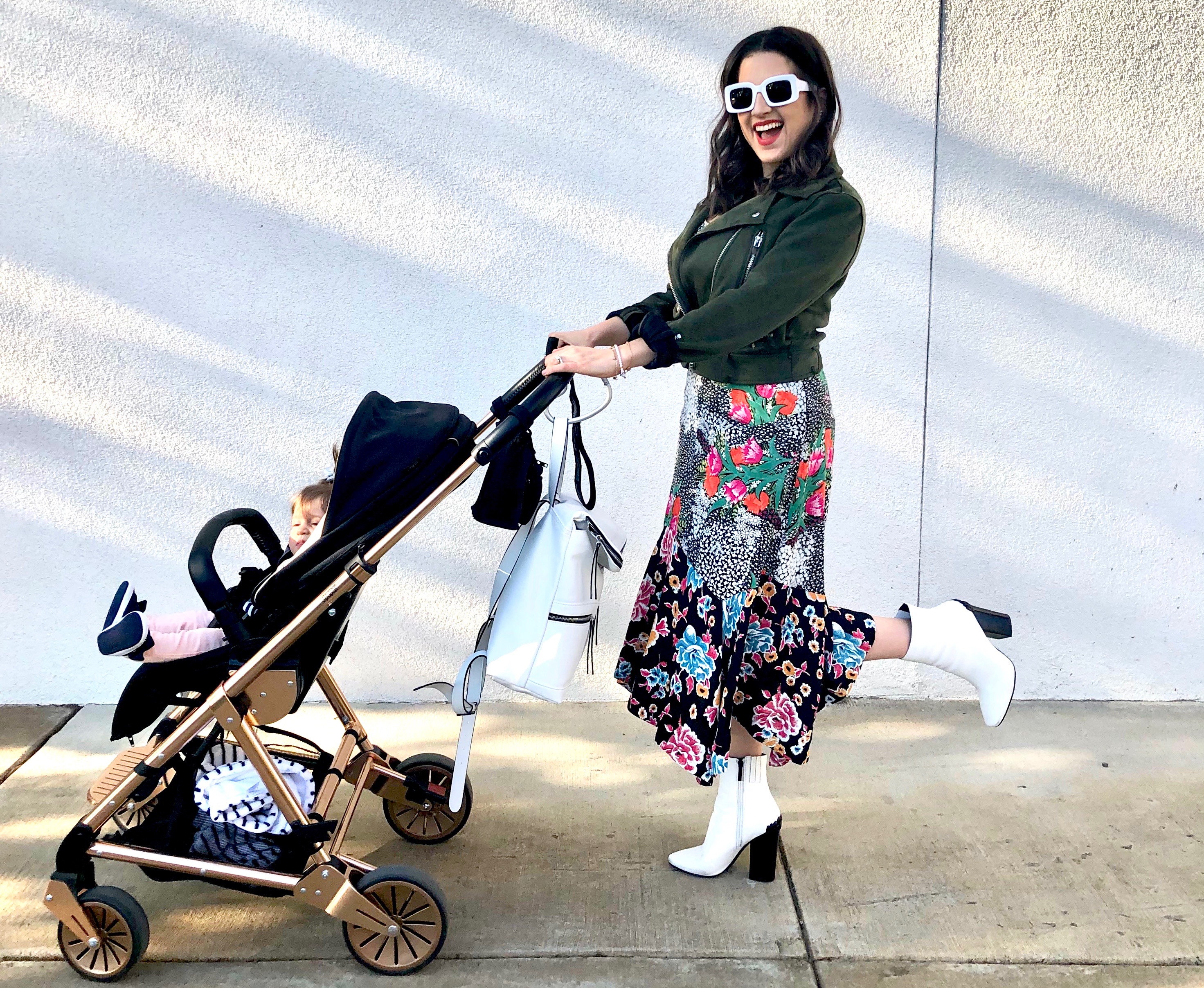 WHAT YOU ACTUALLY NEED FOR YOUR BABY REGISTRY- Dania pushing stroller