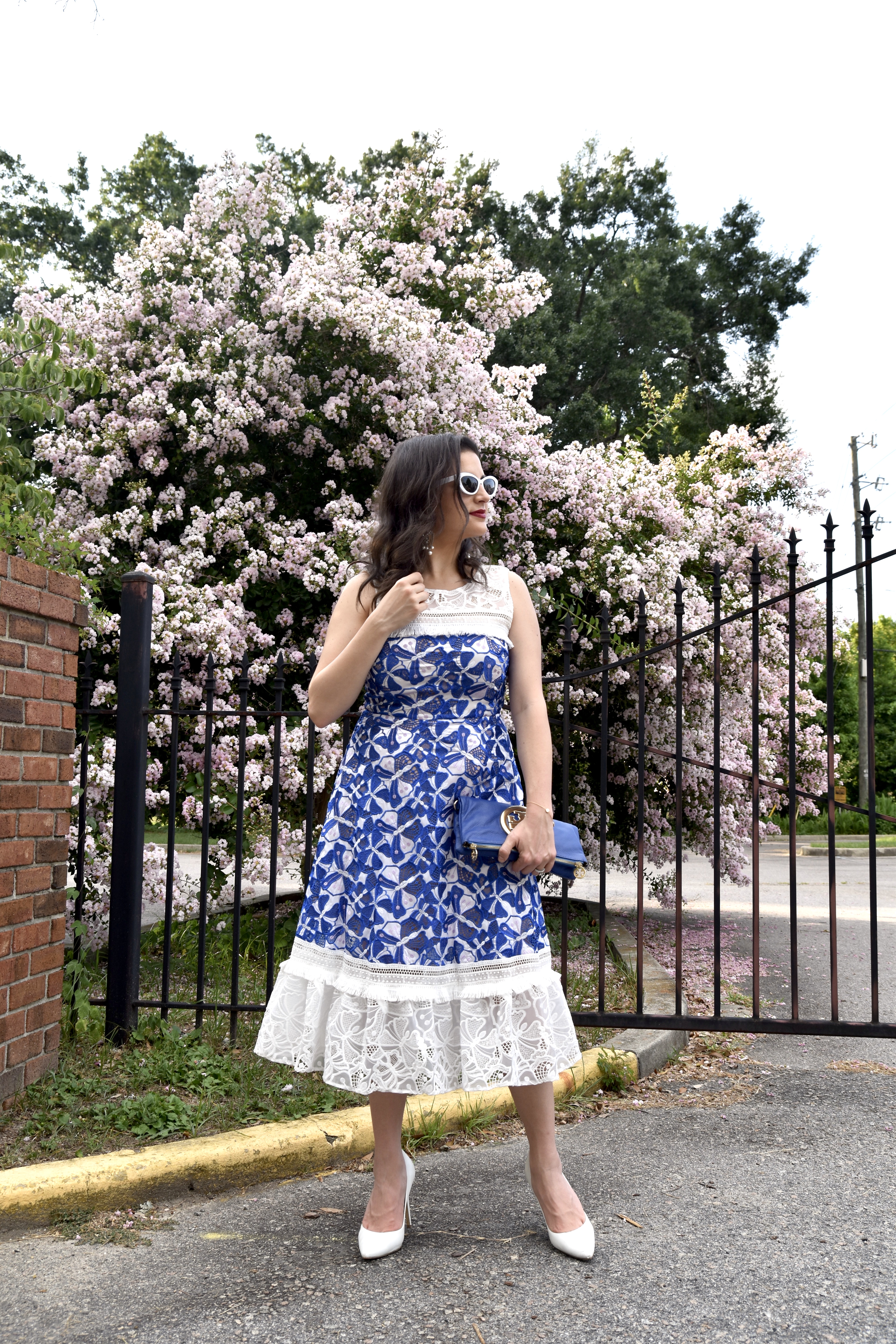 Dania dressed in Badgley Mischka and Tory Burch clutch