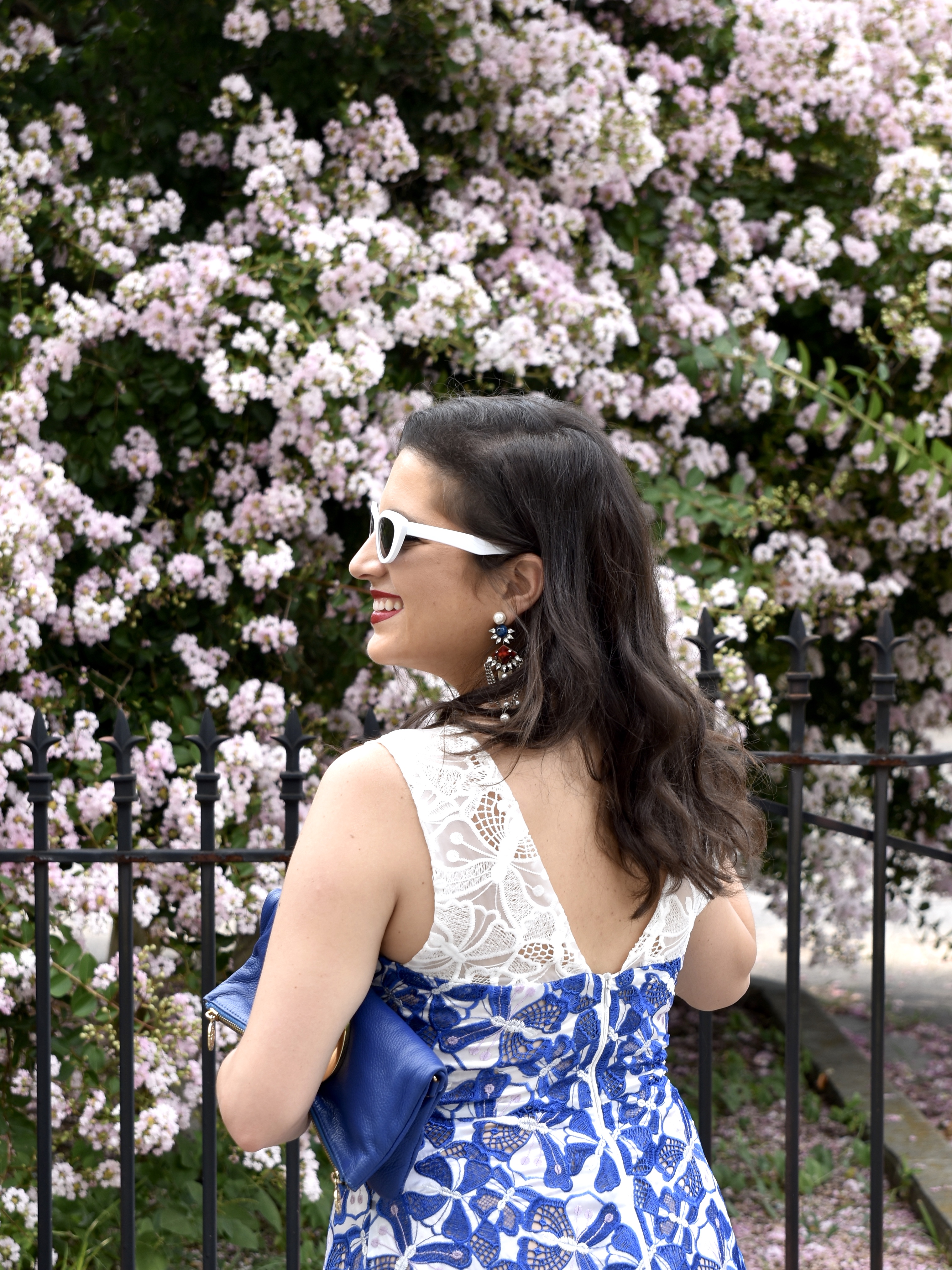 Dania dressed in Badgley Mischka and Tory Burch clutch