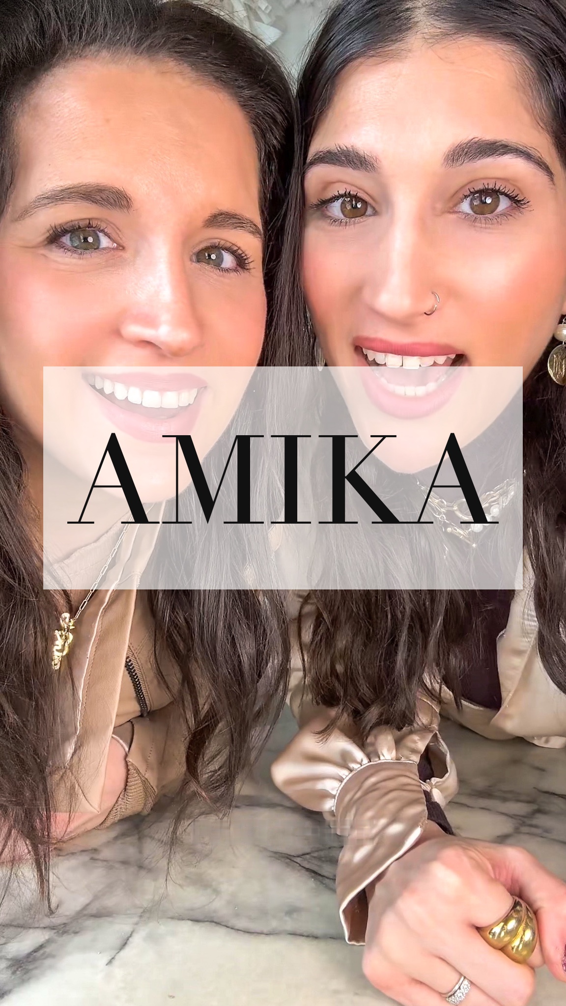 Dania and Aya with the word Amika